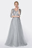 Magical flowy layered A-line tulle gown with three quarter sleeve and lace bodice.